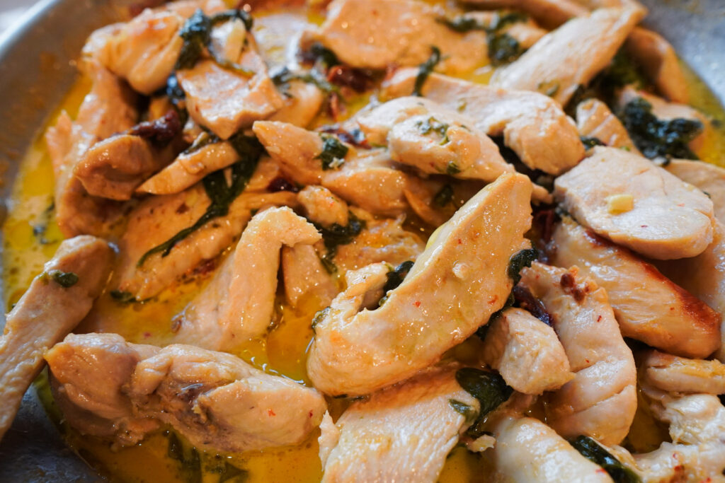 close up details of creamy tuscan chicken