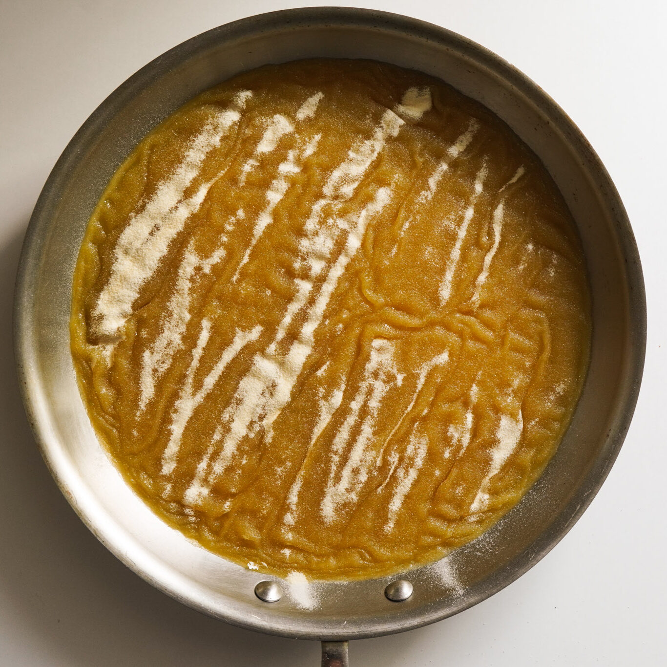 a skillet of warm pineapple juice mixed with beef collagen