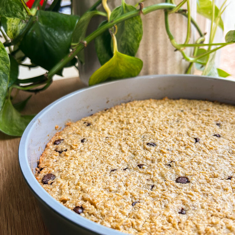 freshly baked chocolate chip oatmeal bake rests on the counter to cool